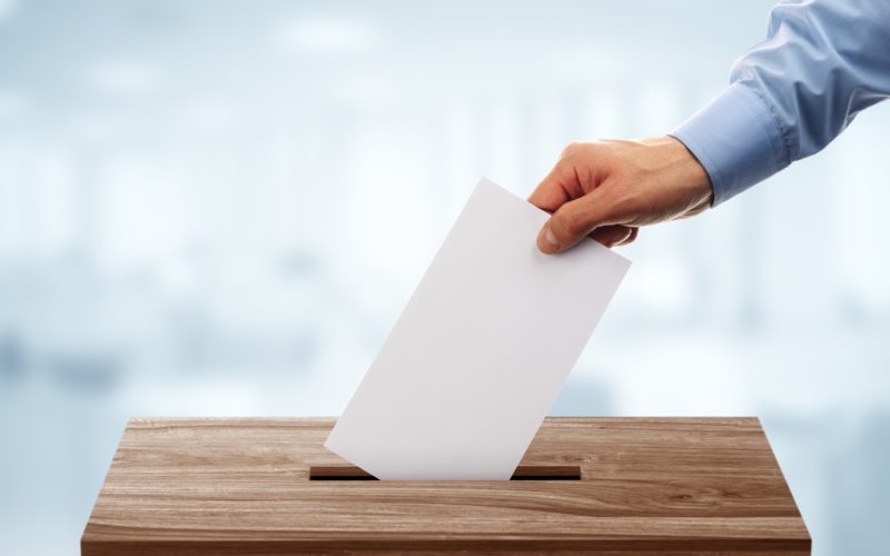 bigstock-ballot-box-with-person-casting-107447402-e1518101056311